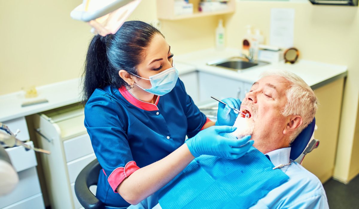 Dentist examines a patient in the clinic